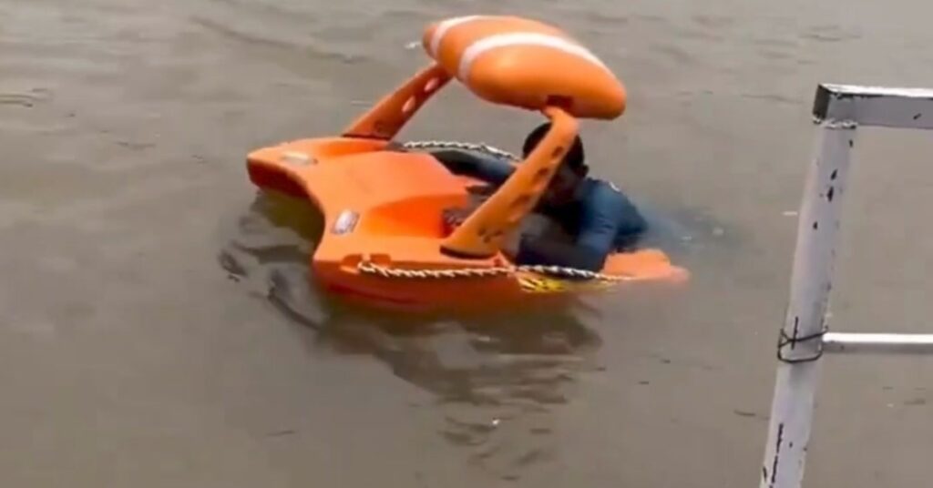 The ITUS Water Drone cutting through floodwaters to deliver emergency supplies in India.