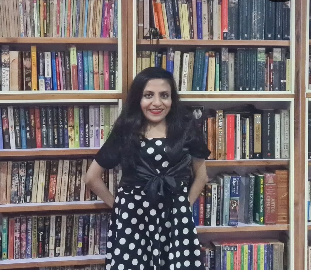 IAS officer Ira Singhal smiling confidently in a formal outfit, symbolizing determination and success despite physical disability.